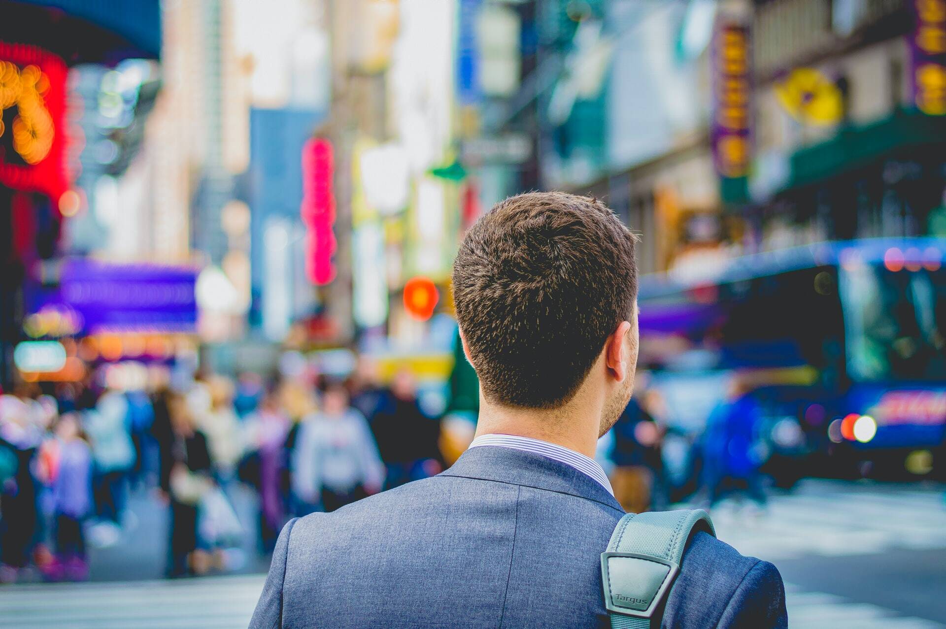 Businessperson walking in a crowded area