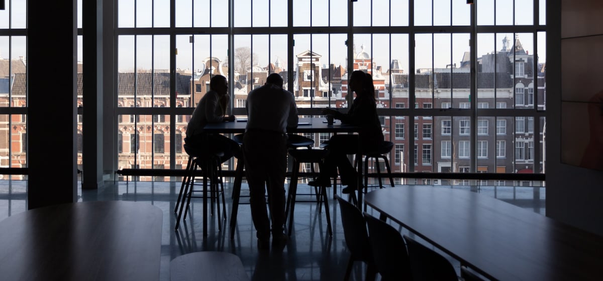 Three people in a meeting