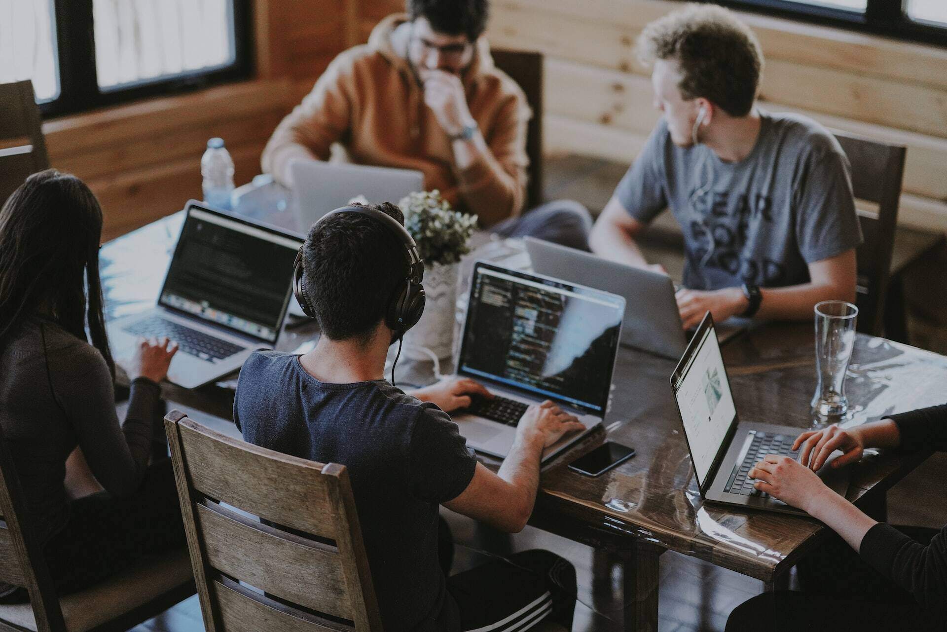 People working in computers doing calculations