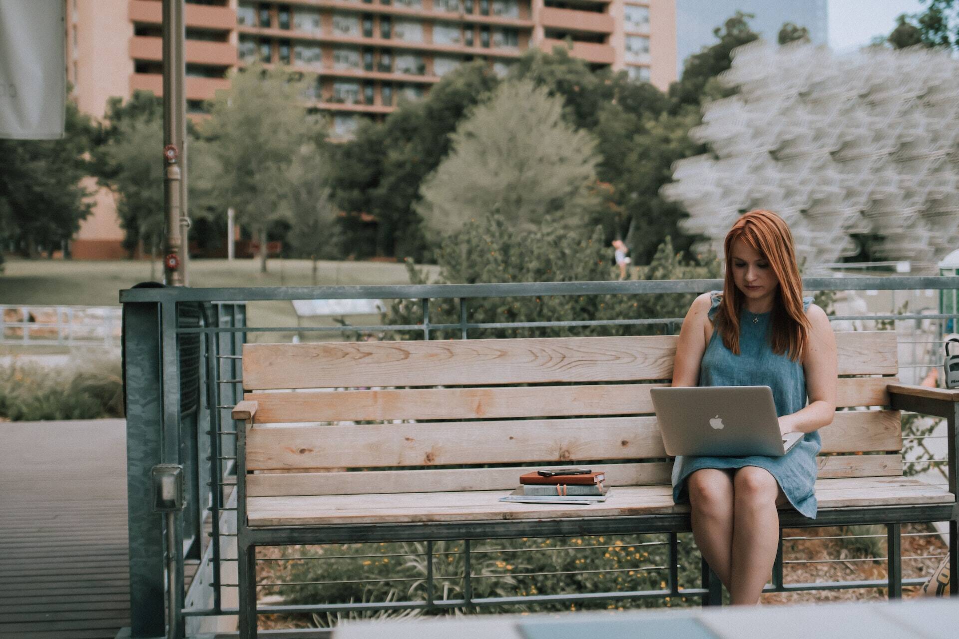 Woman working in her notebook at a park