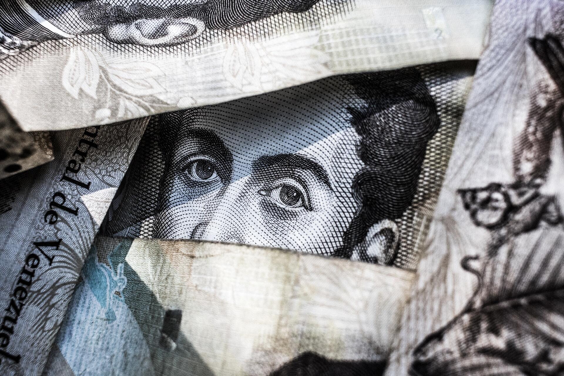 eyes of the character in the dollar bill