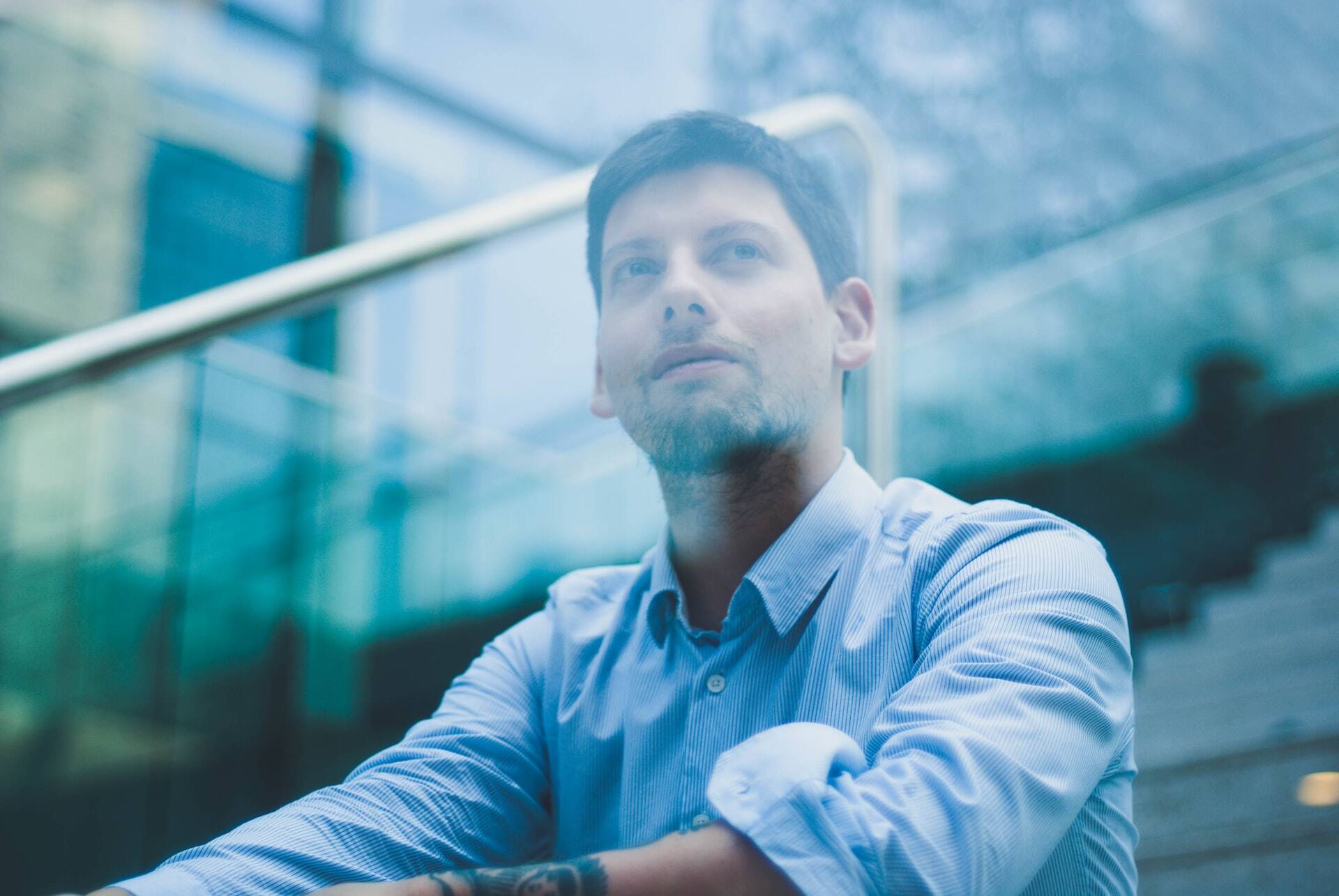 man looking to a landscape thinking