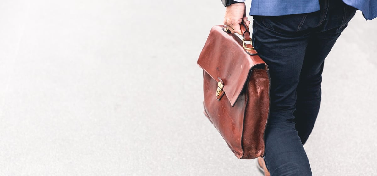 man walking with his suitcase