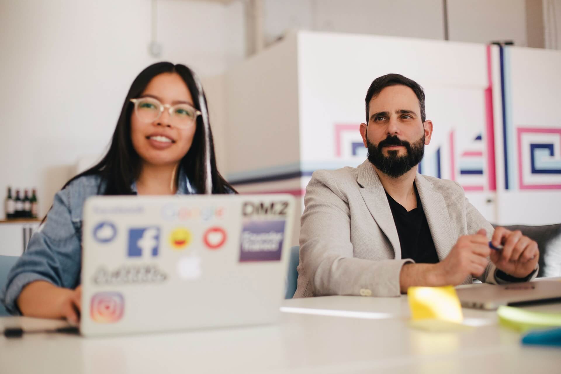 Two people paying attention in a meeting