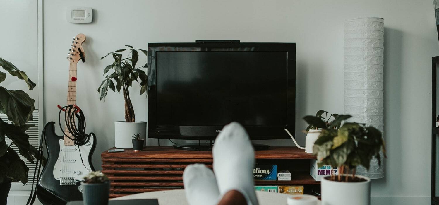 Relaxed person in front of a Television