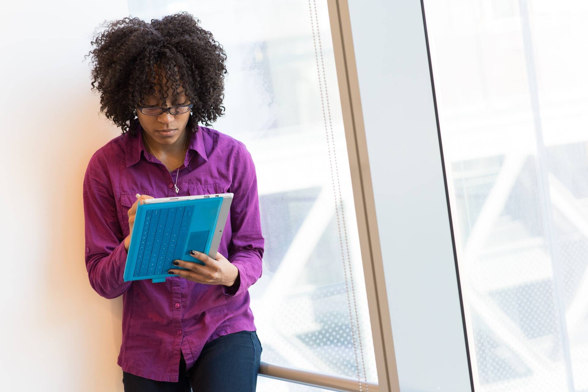 Woman taking notes in a tablet