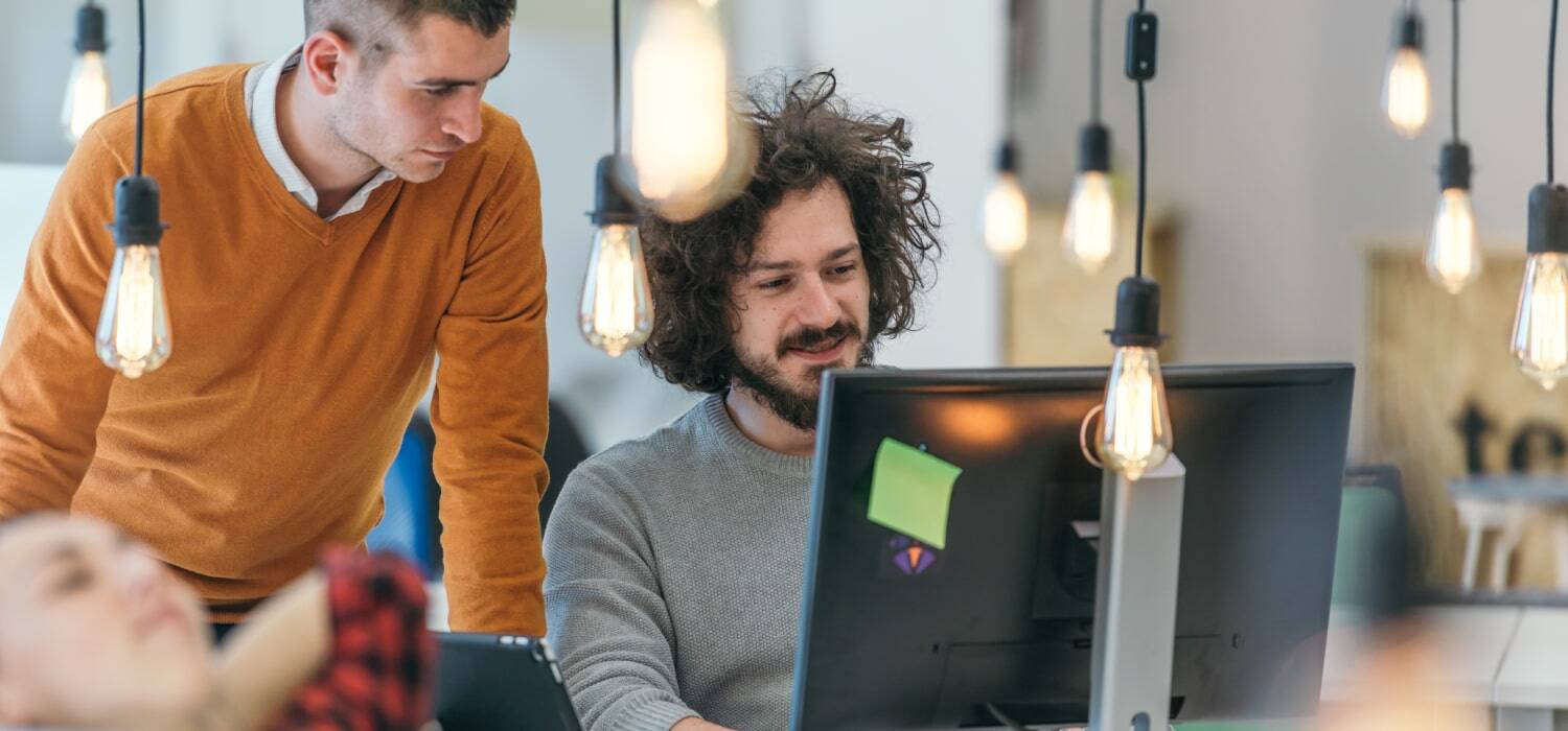 Three man looking at the computer