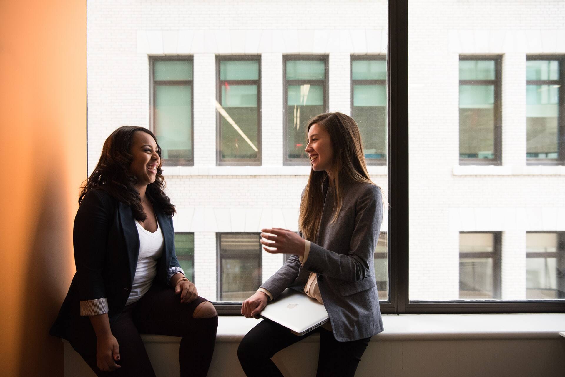 Two women talking at work