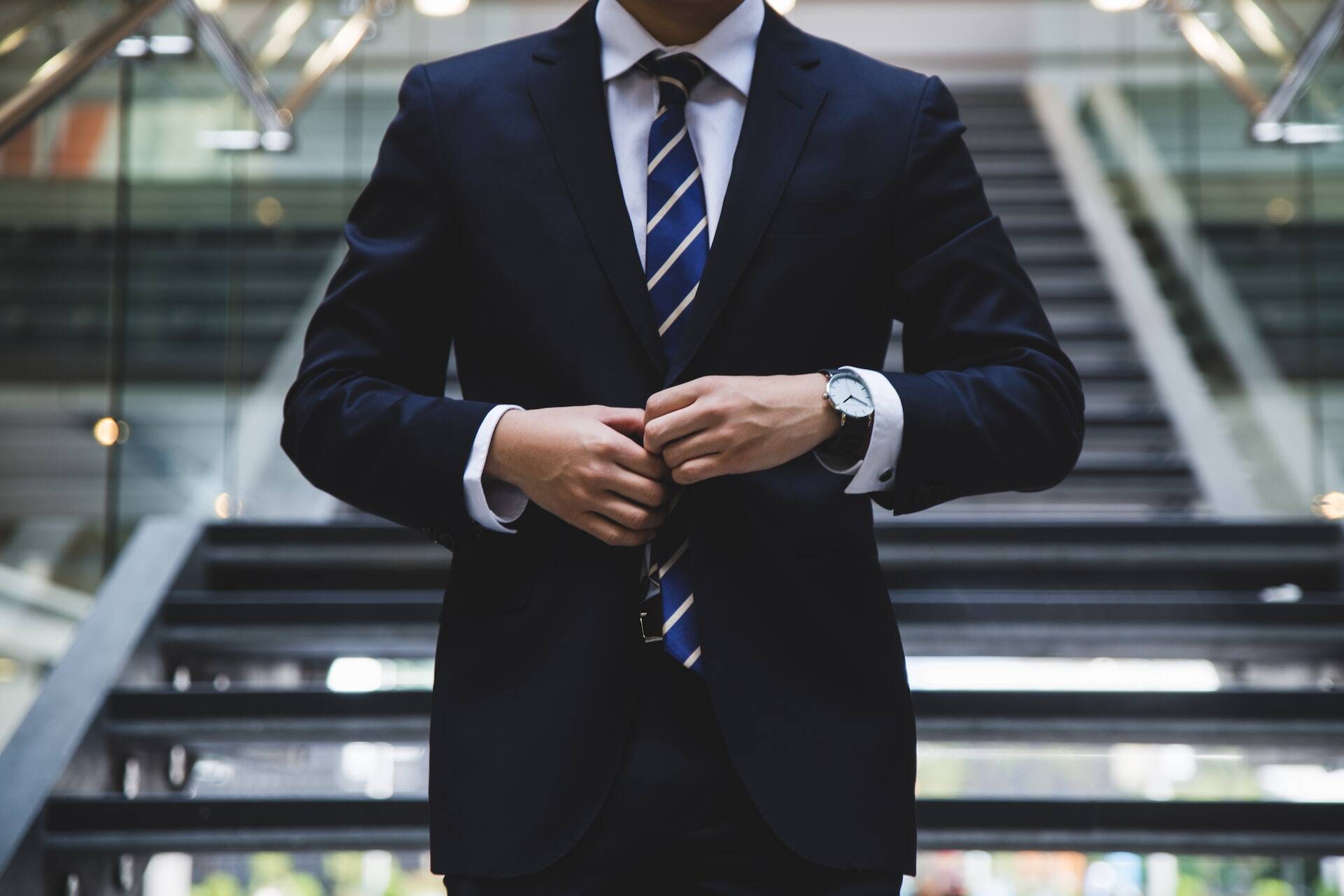 businessman arranging his suit