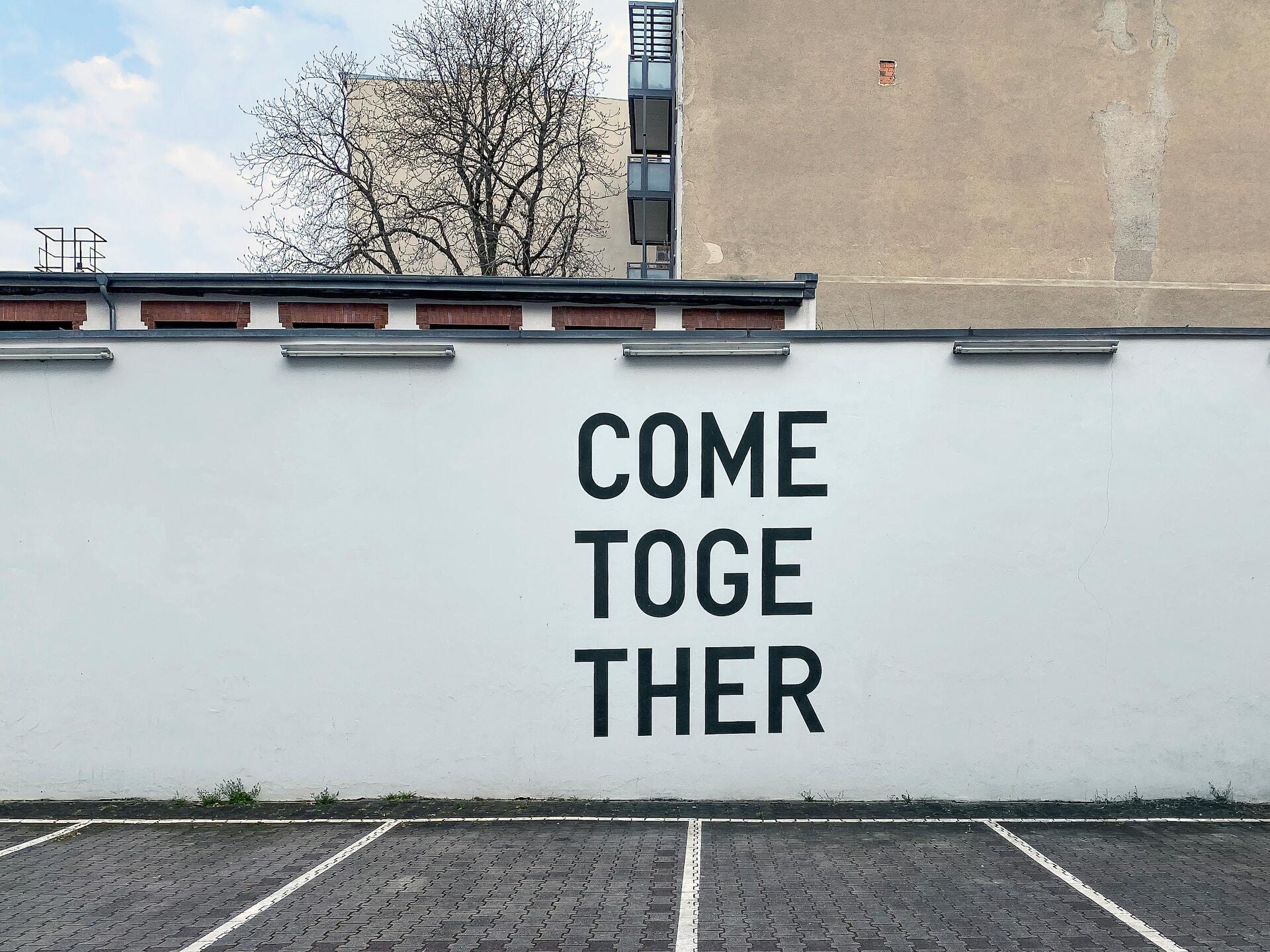 Come together written in a wall