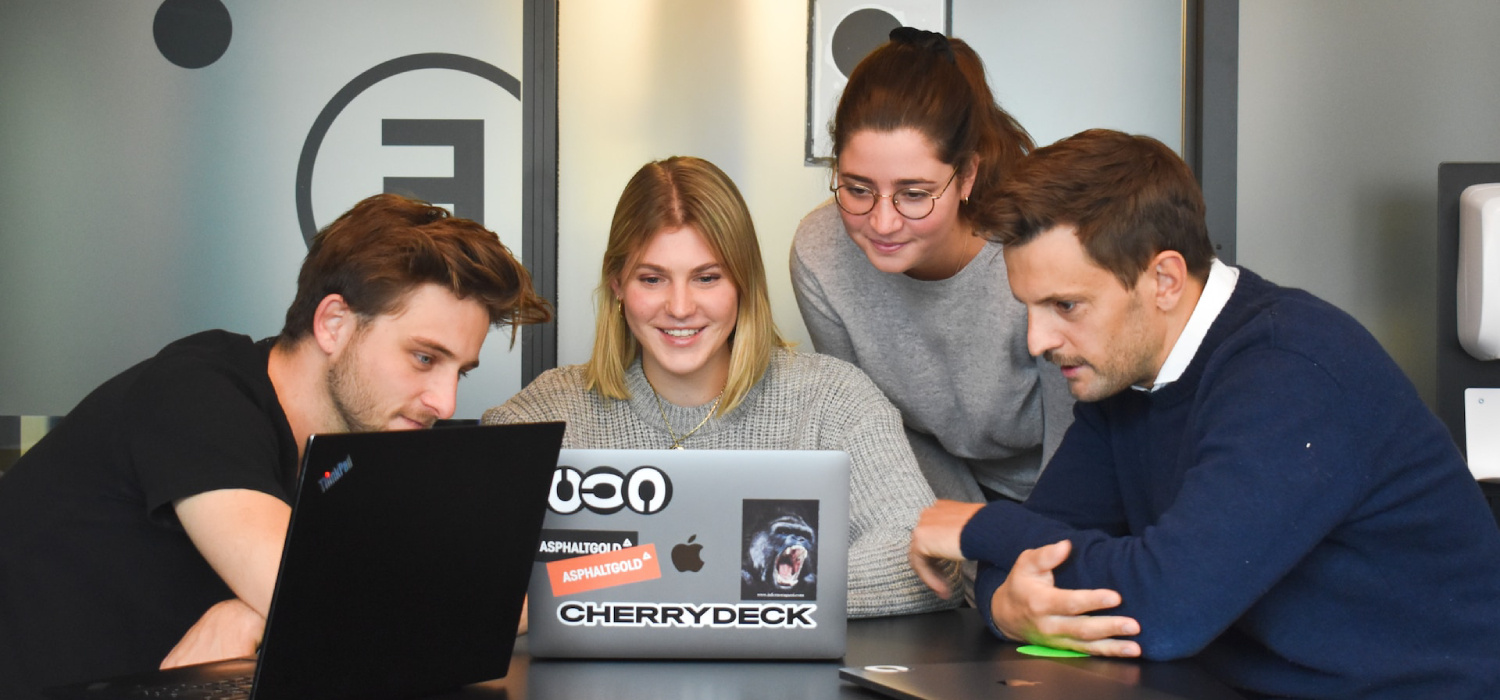 Four happy people in a video conference