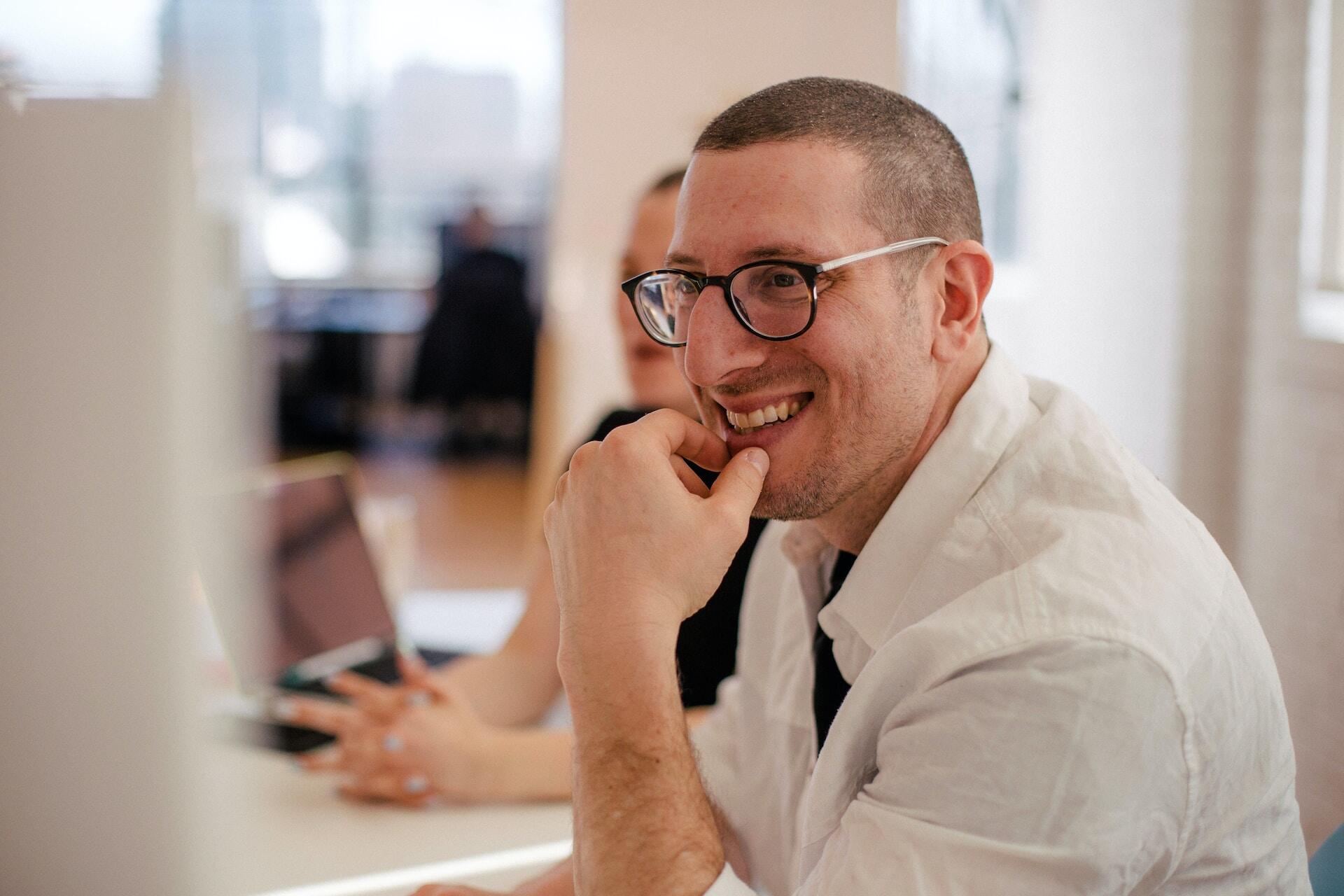 Happy man looking at the computer