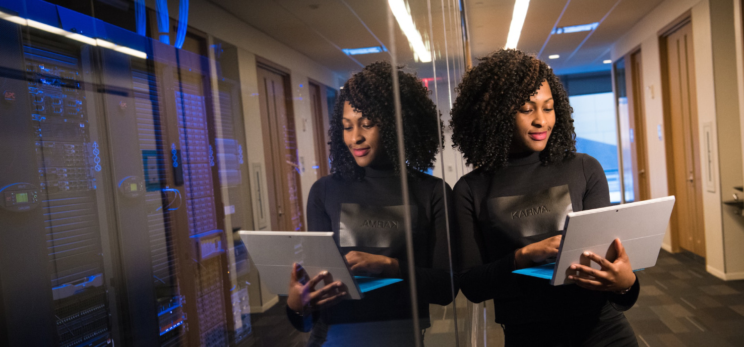 Woman working next to a server