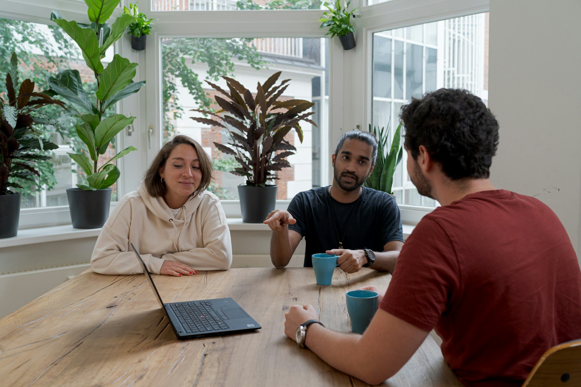 three happy people in a meeting