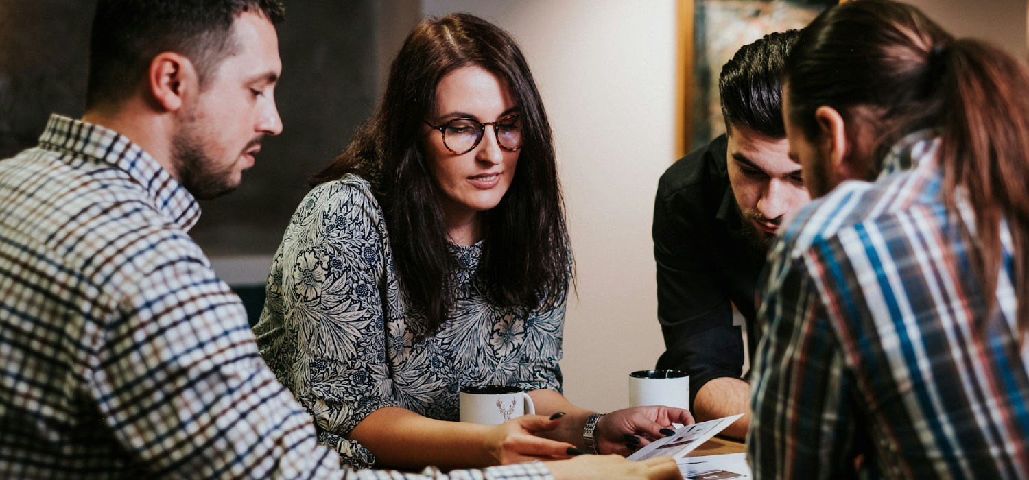 Three people in a meeting